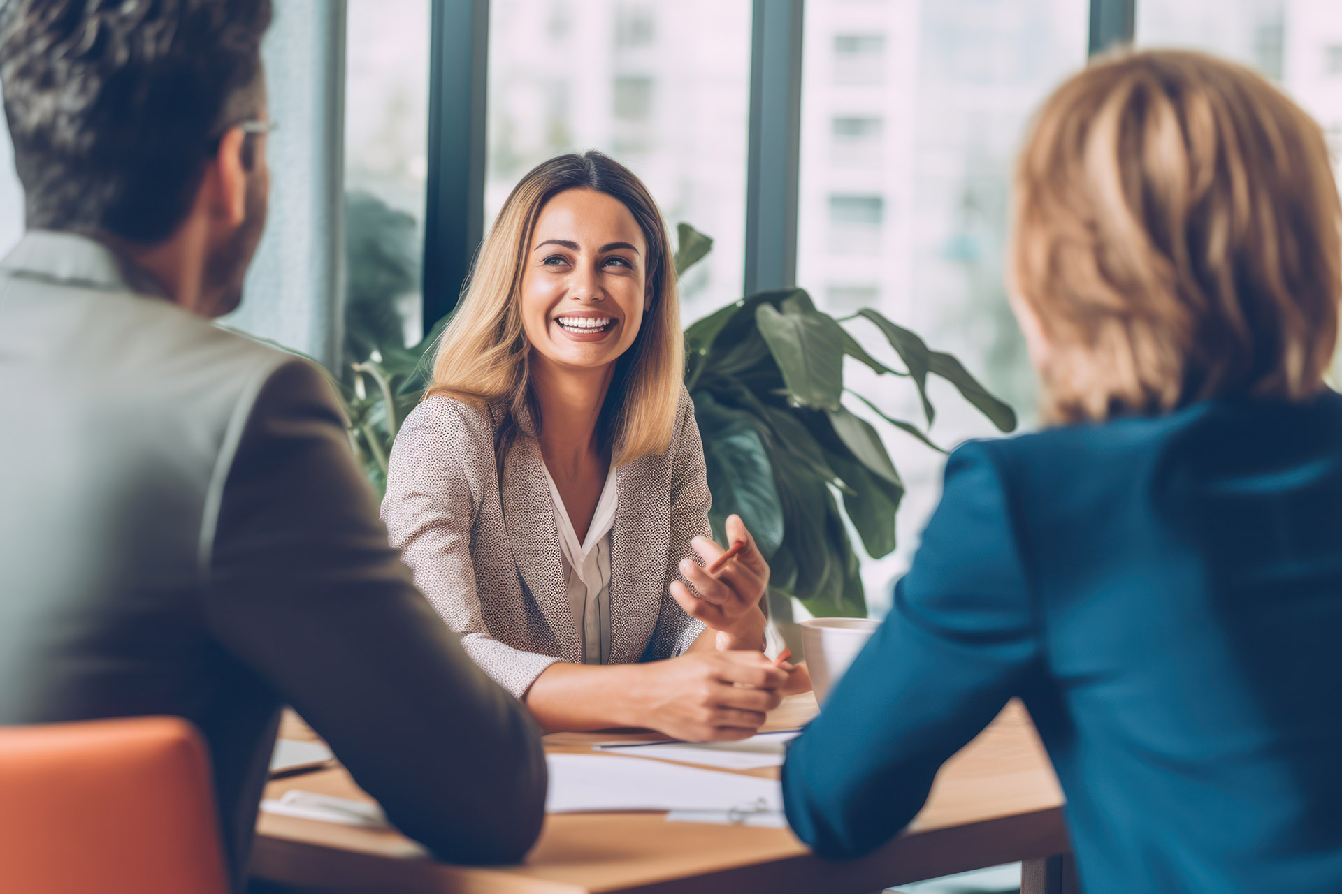 A financial advisor meeting with clients in an office, discussin